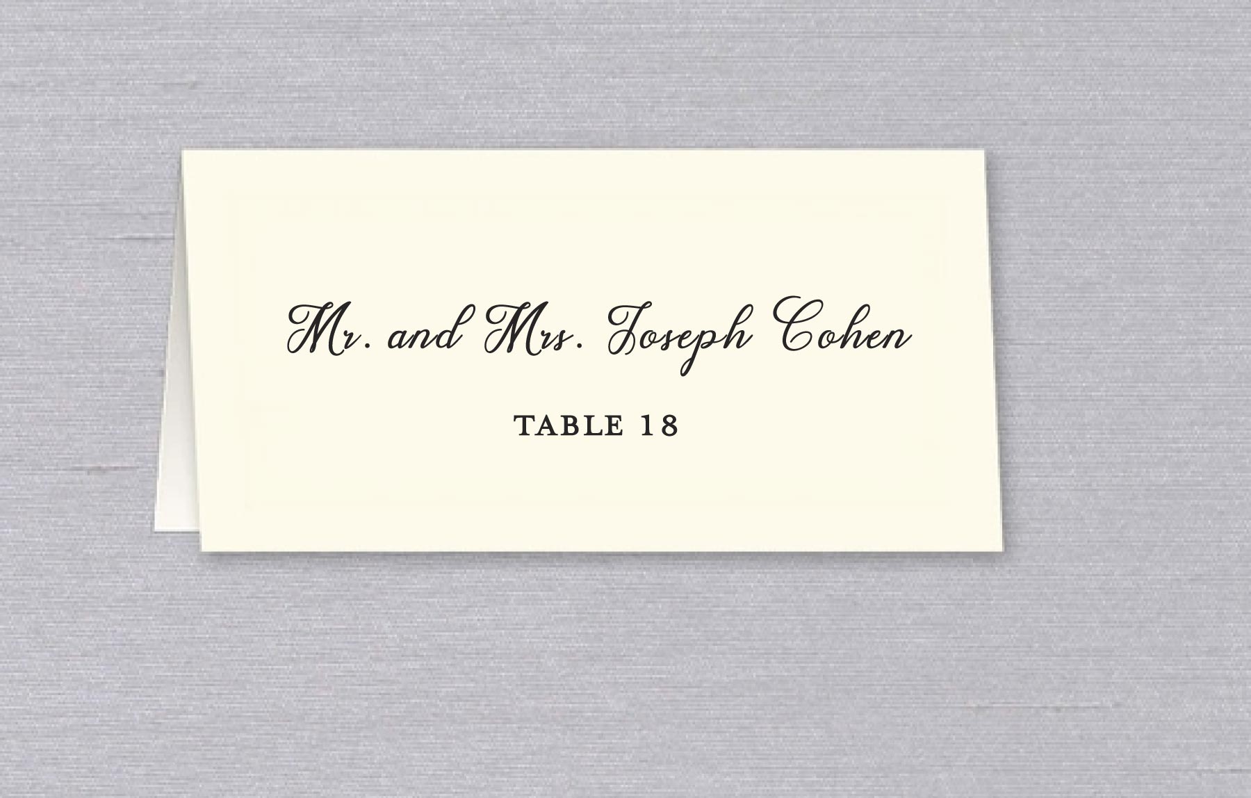 Impress your guests with our elegant and personalized Printing Calligraphy Place Card service. Each place card is available in Ecru or White, printed on 130lb tent-fold cards, featuring your guests' names and table numbers. For an additional fee, you can choose to have the name printed on the front and the table number on the inside, with second-side printing available.