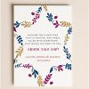 5x7 Rosh Hashanah flat card featuring a Star of David made of navy, plum, and gold botanical leaves with a custom holiday greeting next to a blank envelope.