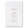 This elegant wedding invitation features a delicate floral letterpress design that gracefully frames the wording with intricate blossoms and lush leaves. Each detail is carefully crafted, with the soft, tactile impression of the letterpress adding a luxurious, sophisticated touch. The textured feel of the paper creates a sensory experience that enhances the overall aesthetic, making it more than just an invitation—it's a keepsake. The intricate floral elements evoke a sense of timeless beauty, while the refined design conveys a romantic and classic elegance. Perfectly suited for a joyous occasion, this invitation sets the tone for a celebration filled with love, elegance, and unforgettable memories.
