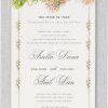 Our Lavish Chuppah Jewish wedding invitation features a vibrant floral design with shades of green and pink flowers adorning the top of the Chuppah. It includes the Pasook 