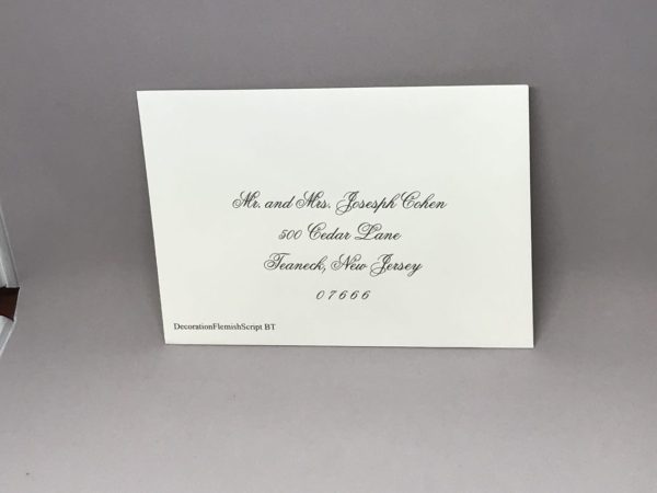 Save time by opting for calligraphy envelope guest addressing with your order, featuring guest addressing tailored to match your unique style. This ensures that upon receiving your invitations, they will be ready for mailing, complete with addresses professionally printed directly onto your envelopes. The font and color will seamlessly match your invitations, creating a cohesive theme, unless you specify changes to the color or fonts. Select your desired quantity, customize your envelope online, and complete your order. Email us your guest addressing list file, and we'll create a layout for your approval. Upon receiving the layout, carefully review it and make any necessary changes or corrections.