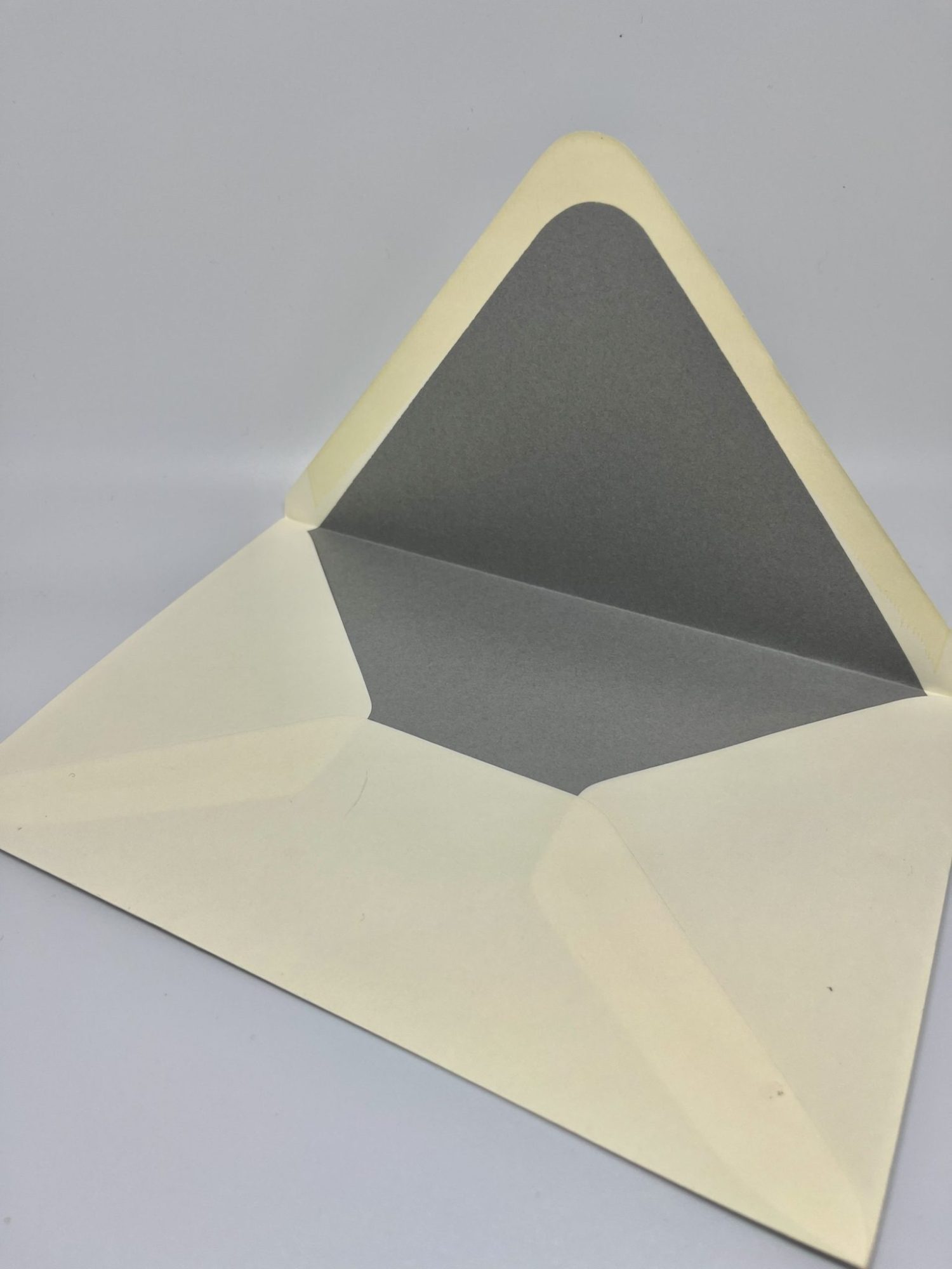 Not satisfied with the envelope you received or printed your invitation elsewhere? You're in the right place! At Cohen Printing, we offer premium envelope upgrades that will elevate your invitations. Our prices include the cost of the envelopes, ensuring transparency and value. Here’s what sets our envelopes apart: 80lb Mohawk Envelopes: We use these high-quality envelopes with a classic Euro flap, providing both a sophisticated look and durability. Hand-Lined Envelopes: Unlike many companies, we hand-line each envelope to order—we don’t buy pre-lined envelopes from the mill. This personal touch ensures a refined and luxurious finish. Real Paper Lining: Our lined envelopes are crafted from genuine colored paper, not a printed background. Many other companies use 20lb white paper and print a color onto it, which can result in a faded, washed-out look. We, on the other hand, source vibrant, high-quality colored paper that provides a richer, deeper color and a more durable, luxurious finish.