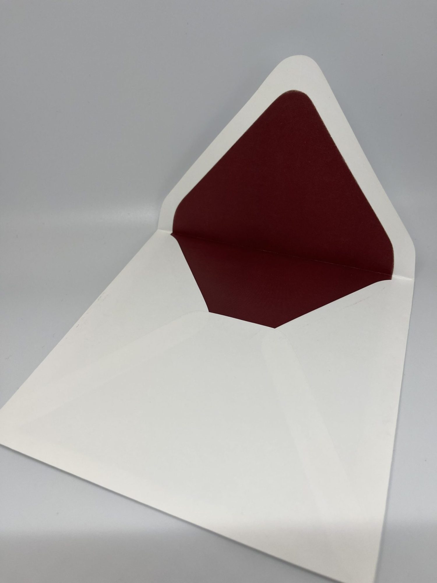 At Cohen Printing, we offer premium envelope upgrades that will elevate your invitations. Our prices include the cost of the envelopes, ensuring transparency and value. Here’s what sets our envelopes apart: 80lb Mohawk Envelopes: We use these high-quality envelopes with a classic Euro flap, providing both a sophisticated look and durability. Hand-Lined Envelopes: Unlike many companies, we hand-line each envelope to order—we don’t buy pre-lined envelopes from the mill. This personal touch ensures a refined and luxurious finish. Real Paper Lining: Our lined envelopes are crafted from genuine colored paper, not a printed background. Many other companies use 20lb white paper and print a color onto it, which can result in a faded, washed-out look. We, on the other hand, source vibrant, high-quality colored paper that provides a richer, deeper color and a more durable, luxurious finish.