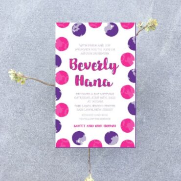 This Bat Mitzvah invitation features a vibrant circle pattern in hot pink and purple, framed by a colorful border that creates a stylish, contemporary look. The bold, artistic border wraps around the invitation, infusing it with elegance and playful charm. In the center, the Bat Mitzvah details are beautifully displayed, with the name of the Bat Mitzvah girl gracefully presented in both Hebrew and English, adding a personal and meaningful touch. This design effortlessly blends timeless tradition with modern sophistication, making it the perfect choice for a chic and unforgettable celebration.