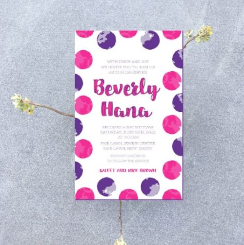 This Bat Mitzvah invitation features a vibrant circle pattern in hot pink and purple, framed by a colorful border that creates a stylish, contemporary look. The bold, artistic border wraps around the invitation, infusing it with elegance and playful charm. In the center, the Bat Mitzvah details are beautifully displayed, with the name of the Bat Mitzvah girl gracefully presented in both Hebrew and English, adding a personal and meaningful touch. This design effortlessly blends timeless tradition with modern sophistication, making it the perfect choice for a chic and unforgettable celebration.