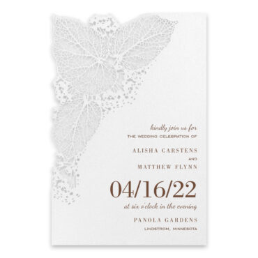 An intricate, laser cut greenery design decorates this beautiful wedding invitation and highlights your wedding wording.