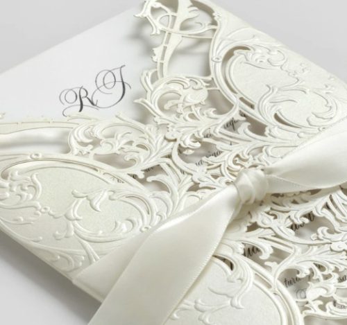You won't believe this isn't real lace. The laser-cut wrap of ecru shimmer paper surrounds an ecru card printed with your wedding news. Exquisite!