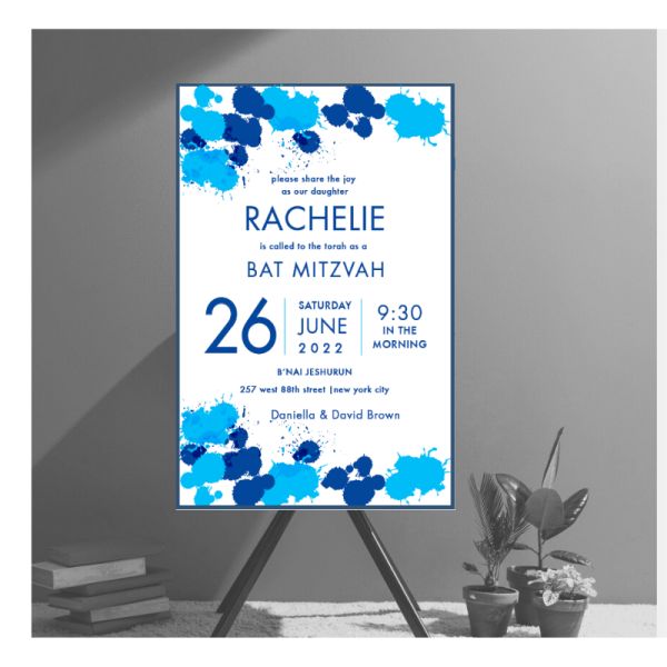 A Watercolor Blue Splash Bar Mitzvah invitation in varying shades of blue. The details of the celebration are presented in a sleek, modern layout with contemporary fonts, framed by a blue border for an elegant touch.