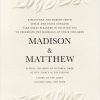 An elegant arrangement of delicate leaves gracefully frames the wording on this stunning botanical garden wedding invitation, featuring a beautifully embossed leaf design at both the top and bottom of the card. The invitation details are centered, featuring modern typography that adds a touch of sophistication and elegance.
