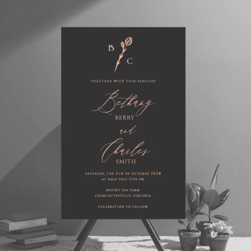 A gorgeous modern wedding invitation with your personalized monogram surrounded by a simple flower. The design includes a clean layout for your wedding details which are written in a mix of modern script fonts.