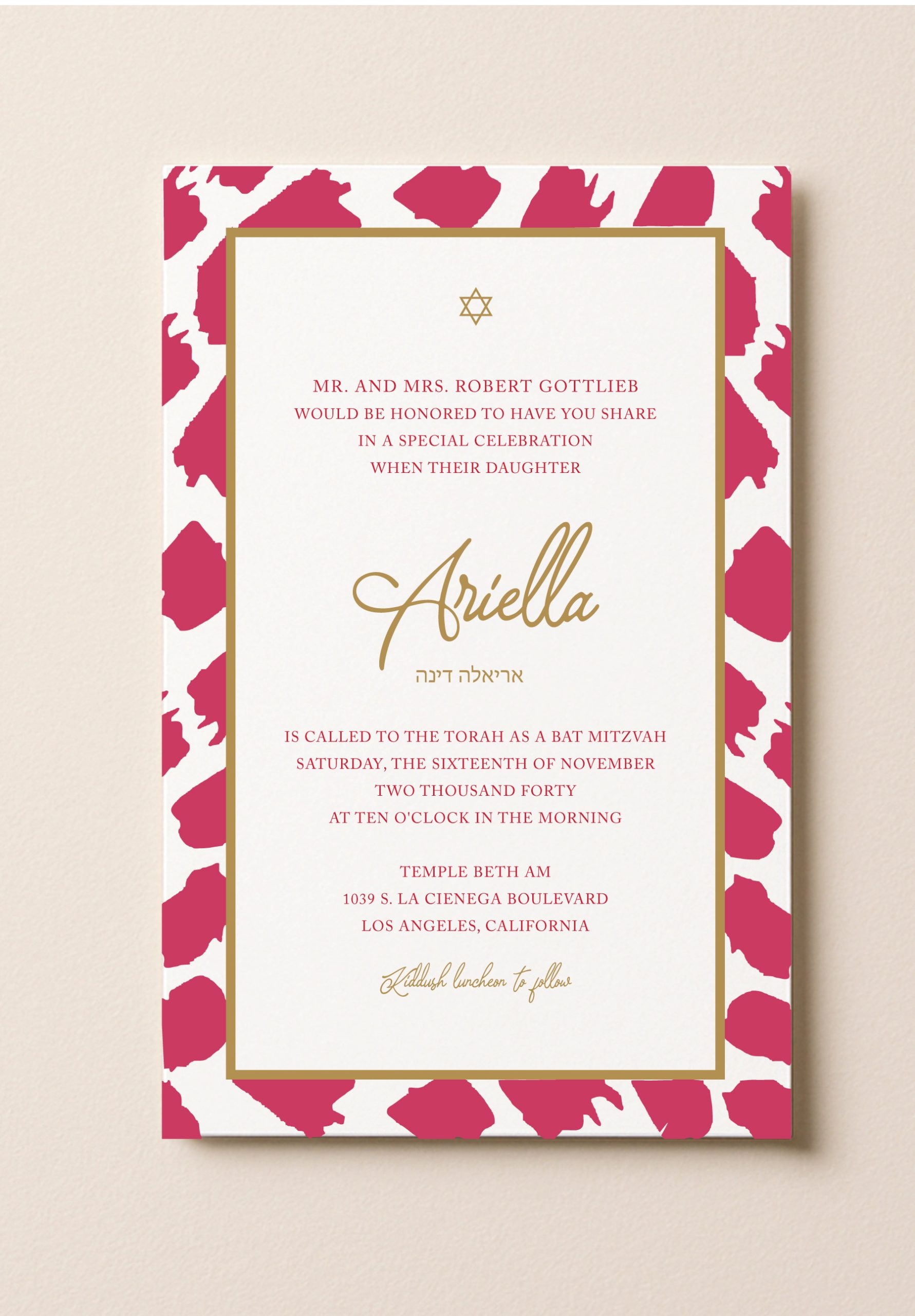 A rectangular Bat Mitzvah invitation featuring a bold hot pink abstract brushstroke border and a double gold frame. The white center contains formal text with a gold Star of David at the top, the name Ariella in elegant gold script, and matching Hebrew typography.