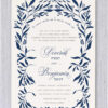 Elegant and Timeless Floral Jewish Wedding Invitation featuring a delicate floral border that gracefully frames the Hebrew text. The phrase Ani Ledodi V'Dodi Li is beautifully arched at the top, with the wedding details displayed in sophisticated typography. The names of the bride and groom, along with their Hebrew names, are highlighted in navy, adding a refined and elegant touch