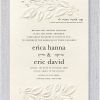 An elegant arrangement of delicate leaves gracefully frames the wording on this stunning Jewish wedding invitation, featuring a beautifully embossed leaf design at both the top and bottom of the card. At the top, the phrase 