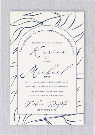 Blowing Leaves Jewish Wedding Invitations is a steadfast favorite in our Jewish wedding collection. Here, we gave it the "Blowing Leaves in Navy" treatment, making it the perfect invitation suite for an elegant, contemporary affair. A heading "I am my beloved and my beloved is mine" in Hebrew and English around the floral border adds a touch of playfulness.