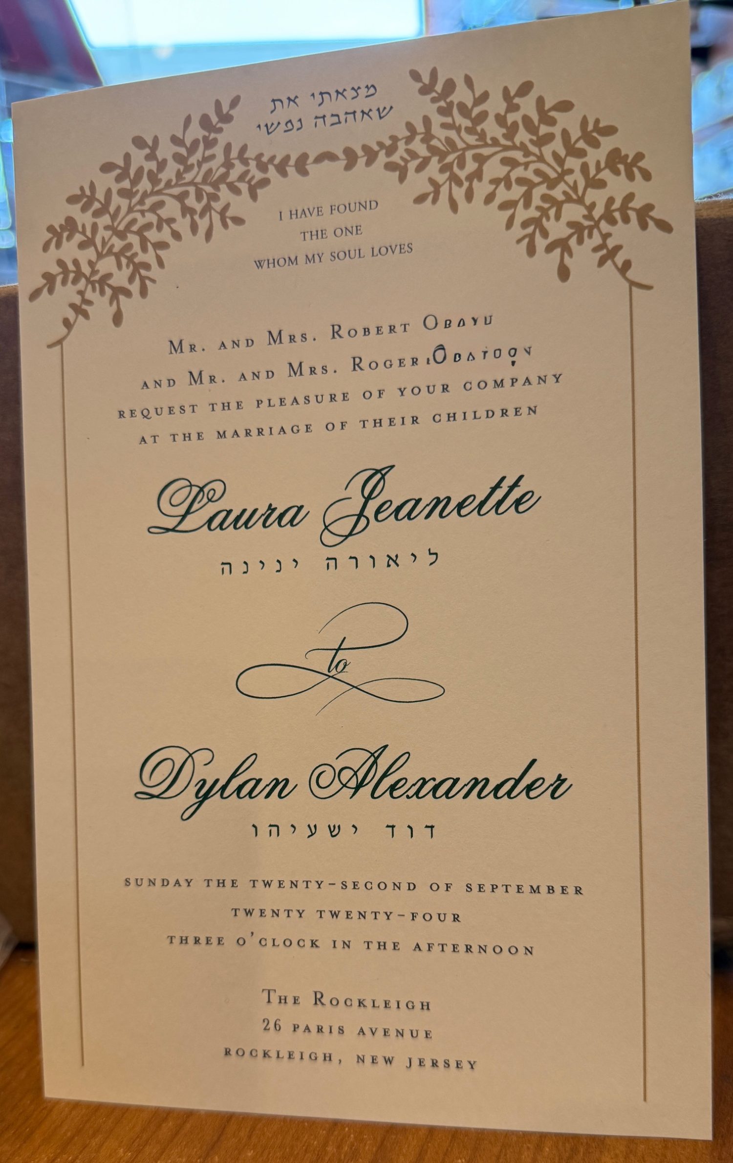 Our stunning Chuppah Jewish wedding invitation is truly one of a kind. Unique and distinct, it features a Chuppah adorned with golden leaves. At the top, the beautiful verse "I have found the one whom my soul loves" is elegantly displayed in both Hebrew and English. The names of the bride and groom are presented in a modern print font, alongside their Hebrew names. This invitation is perfect for celebrating a Jewish wedding.