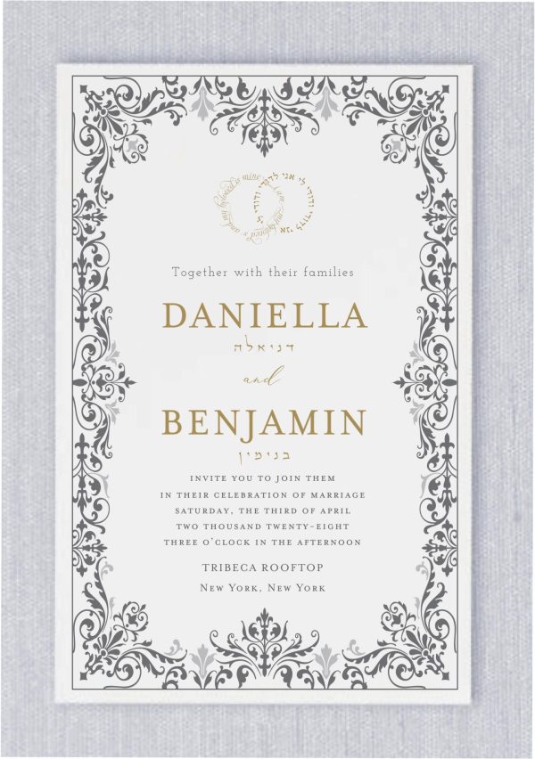 Introducing 'The Fancy Brocade' - A Beloved Choice in Our Jewish Wedding Invitation Collection. Featuring a luxurious brocade border delicately woven in hues of smoke and light smoke enveloping the invitation, with the crowning touch of wedding rings atop, adorned with the timeless inscription 'I am my beloved's, and my beloved is mine' in both Hebrew and English. The names of the bride and groom are elegantly rendered in a contemporary serif font, adding a touch of modern sophistication to this timeless design."