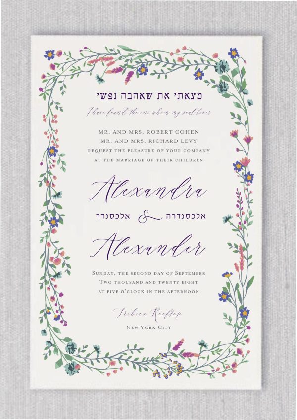 Our Charming Wildflower Jewish Wedding Invitations are a timeless favorite for garden-themed celebrations. Adorned with a watercolor floral border in captivating shades of blue and purple, this striking design stands out in our collection. Surrounded by delicate wildflowers, we’ve infused it with a “modern green affair” touch, making it ideal for an elegant and contemporary event.
