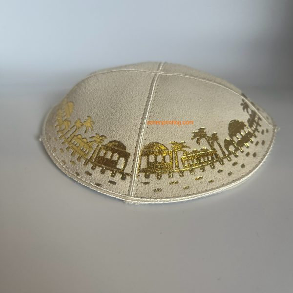 Chai Embossed - Kippah, Our embossed foil kippah, meticulously crafted from luxurious suede, showcases a refined 4-panel design and stands at an elegant 3" high. The foil embossing can be rendered in various exquisite colors. The price includes a custom plate and design, along with a selection of sophisticated fonts at no extra charge.
