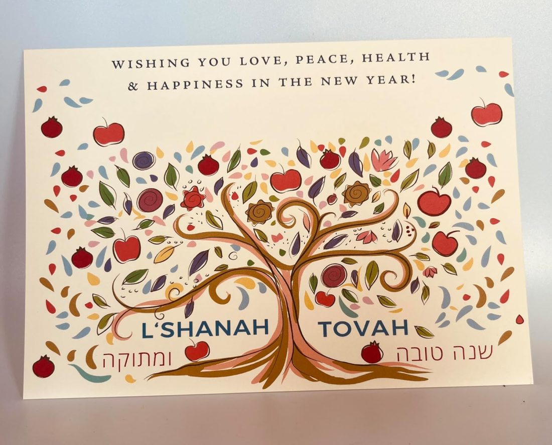 Celebrate Rosh Hashanah in style with our exquisite "Sweet Year" card, adorned with vibrant pomegranates and apples. This unique design beautifully captures the essence of the holiday, ensuring your greetings make a lasting impression. Personalize your card with a special note or signature to add a personal touch that will be cherished for years to come. Our new line of Jewish New Year cards features a sleek, flat design that offers ample space for your customization. Send a distinctive, high-quality card that will stand out and be treasured by your loved ones. Size: 5″ x 7″ (Flat Card) Printed On: Luxurious 130 lb heavy card stock. Made In: 100% in America Included: 5 cards and 5 corresponding envelopes