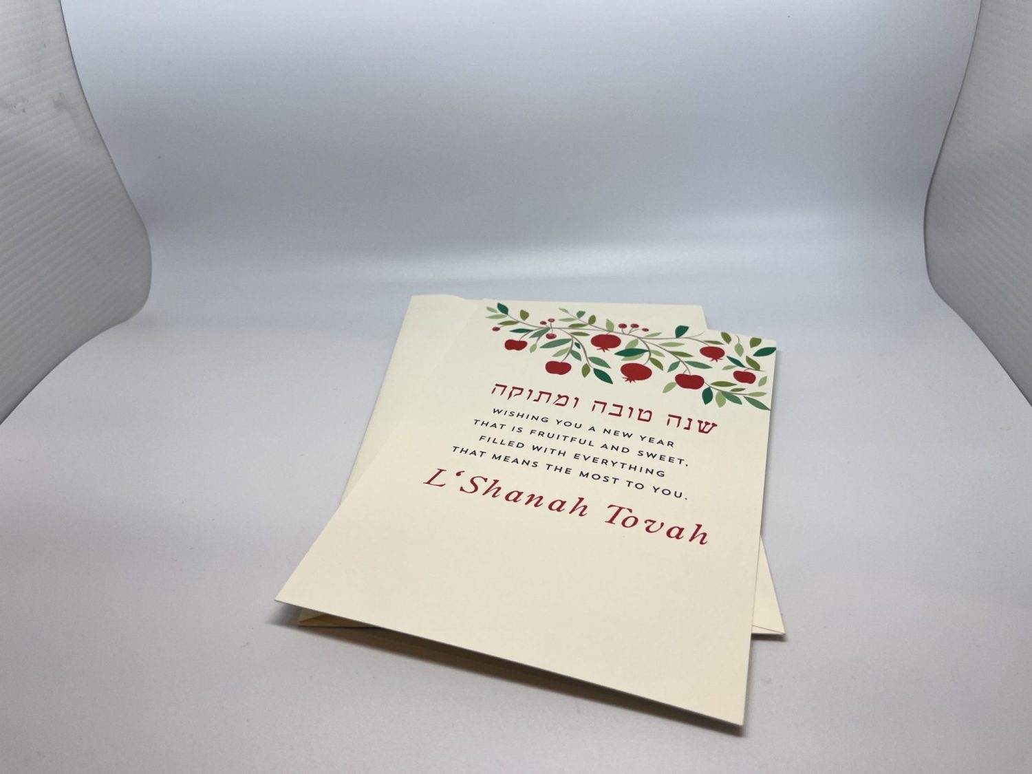 Embrace the spirit of the red Apple Jewish New Year with our beautifully designed Shining Pomegranate greeting cards. Each card features a heartfelt message while providing space for your personal wishes. Instead of printing your name, you can add your own unique message, making each card truly special. Share joy and warmth with your loved ones this Rosh Hashanah and spread the blessings of the Jewish New Year!