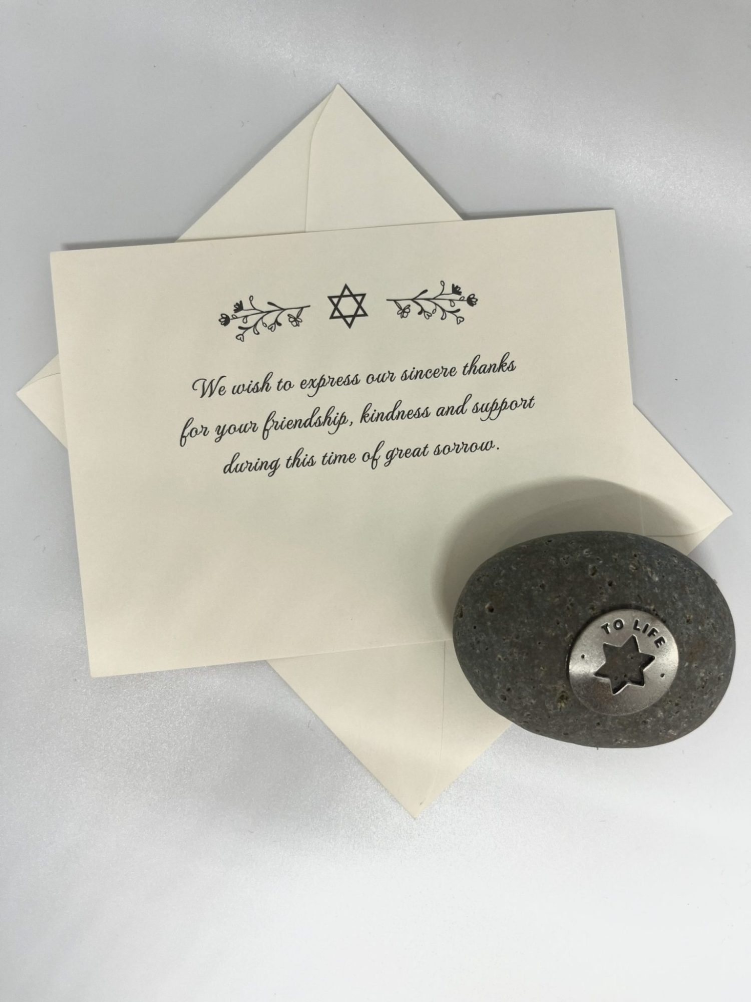 Our unique sympathy card is designed to offer comfort and support during difficult times. The elegant floral Star of David adorns the front, conveying a heartfelt message while leaving space for your personal note to family and friends. Each card comes with a stylish euro flap envelope, adding an extra touch of elegance and appreciation for those who stand by you. A thoughtful way to express gratitude and share your feelings during times of loss.