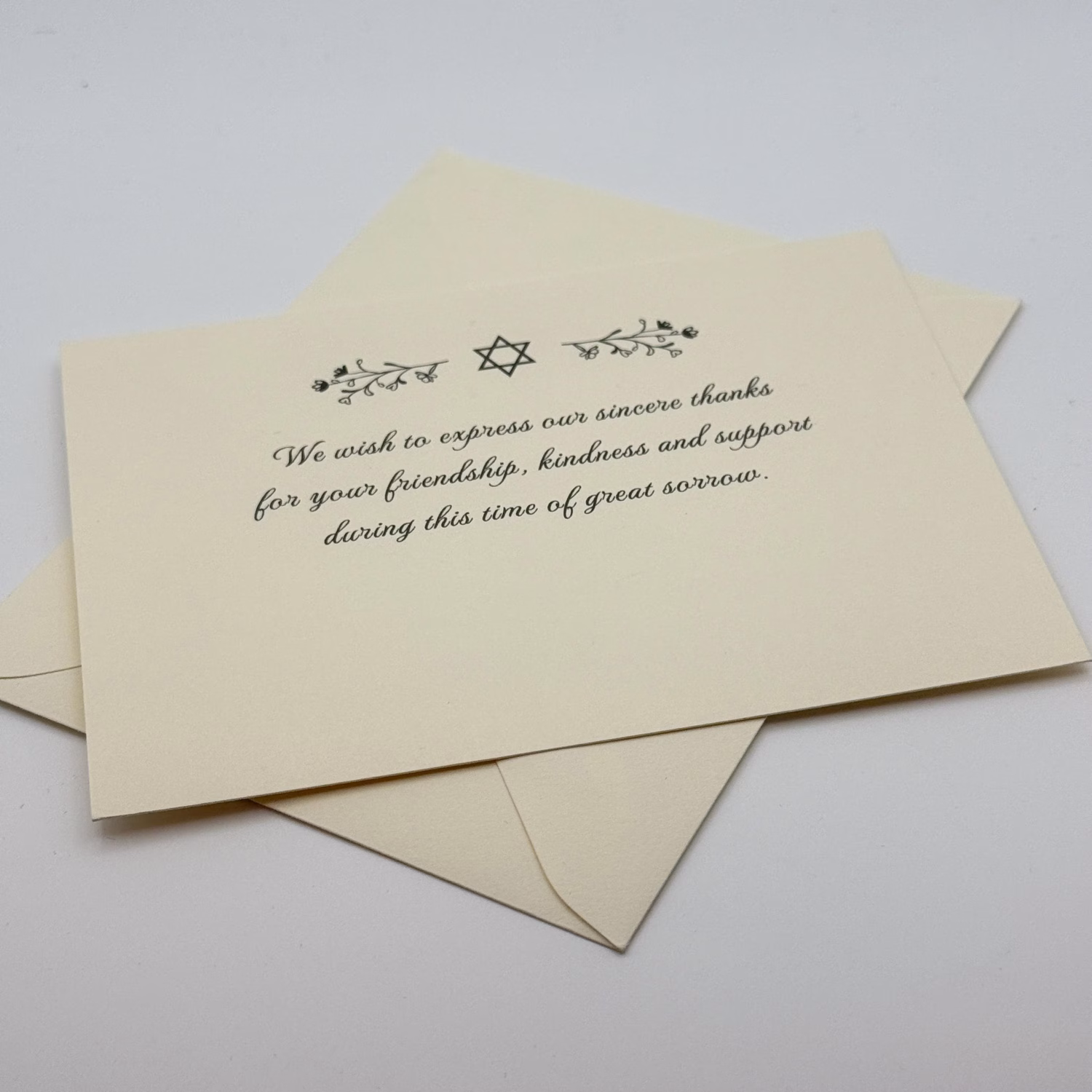 Our unique sympathy card is designed to offer comfort and support during difficult times. The elegant floral Star of David adorns the front, conveying a heartfelt message while leaving space for your personal note to family and friends.
