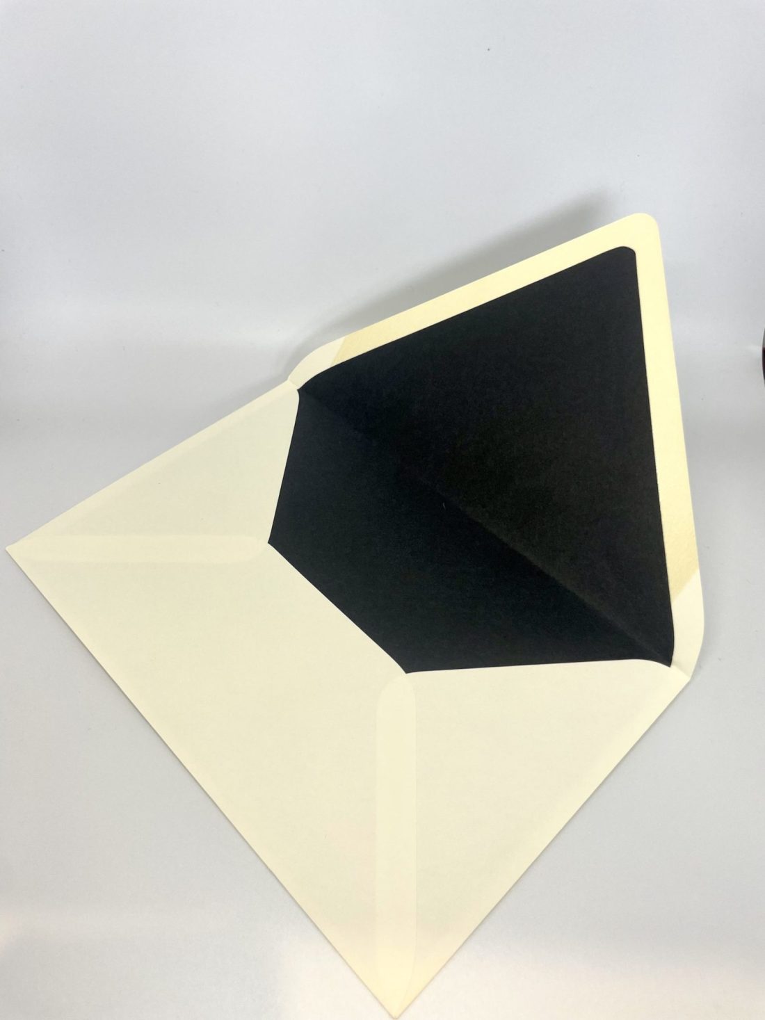 Enhance your invitations with our custom hand-lined envelopes in stunning colors. Our LUX Lined envelopes come in Antique Gold, Dark Smoke, Navy, Wine, and Black, with the elegant lining extending from the flap to the bottom. For an extra touch of sophistication and convenience, consider adding personalized printing for both your return address and your guests’ addresses. It’s a thoughtful detail that not only elevates the presentation but also saves you time.