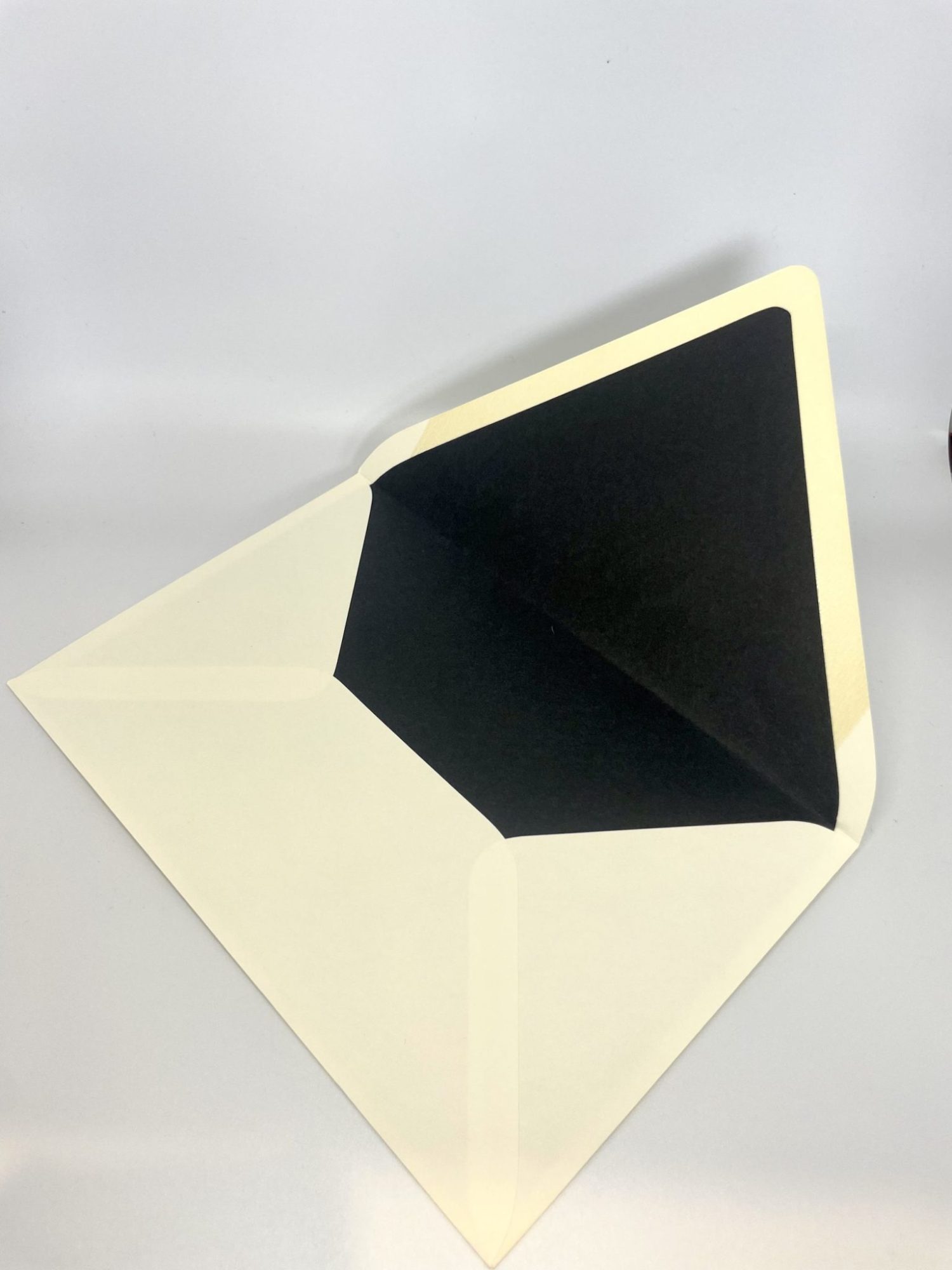 Enhance your invitations with our custom hand-lined envelopes in stunning colors. Our LUX Lined envelopes come in Antique Gold, Dark Smoke, Navy, Wine, and Black, with the elegant lining extending from the flap to the bottom. For an extra touch of sophistication and convenience, consider adding personalized printing for both your return address and your guests’ addresses. It’s a thoughtful detail that not only elevates the presentation but also saves you time.