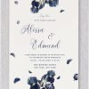 Stunning wedding invitations adorned with beautiful bluish-toned flowers surrounding this wedding invitation. The bride and groom’s names are prominently displayed in bold, contemporary typography, creating a stylish and sophisticated look for this memorable occasion.