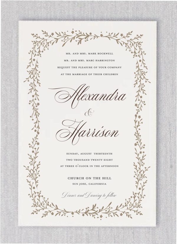 This Leafhaven Wedding Invitation features a stunning leaf border in unique ink, with your names displayed in a distinctive staggered layout. The remaining details are elegantly presented in a classic sans-serif font."