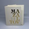This Gold Foil Mazal Tov Greeting Card is a stunning way to celebrate weddings, Bar or Bat Mitzvahs, and new beginnings. Featuring a bold, modern typographic design with Mazal Tov in both English and Hebrew, the shimmering gold foil adds a touch of elegance to any occasion. Each card is printed on our signature 130lb. premium heavy ecru cardstock using professional presses for a high-end, tactile feel. The inside is left blank for your own personal message.