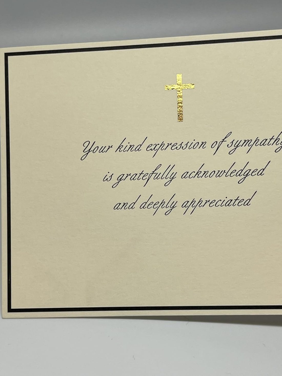 Our Christian Sympathy Thank You Cards provide a graceful and dignified way to acknowledge the kindness of friends and family during a difficult time. This design features a shimmering gold foil cross centered within a sophisticated black border, paired with an elegant script that reads, "Your kind expression of sympathy is gratefully acknowledged and deeply appreciated." Each card is printed on our signature 130lb. premium heavy ecru cardstock using professional presses to ensure a high-end, tactile feel. These are flat note cards, offering a clean and polished look for your personal acknowledgments.