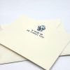 Cream-colored invitation card with navy blue lion head and Star of David logo, featuring Hebrew text and