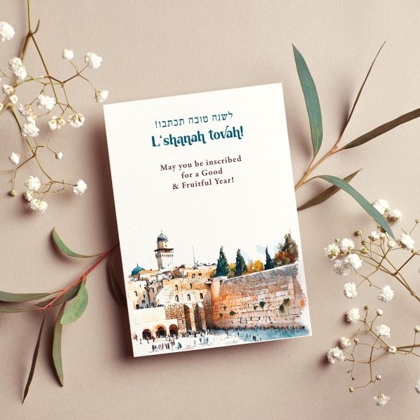 Rosh Hashanah greeting card with watercolor Western Wall Jerusalem illustration, Hebrew text לשנה טובה תכתבו ותחתמו and L'Shanah Tovah inscription, cream background