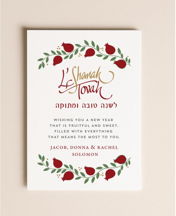 Celebrate the Jewish New Year with this cheerful and colorful Rosh Hashanah greeting card featuring the classic symbols of the holiday — apples, honey, pomegranates, and bees framed in a beautiful watercolor wreath. The card reads שנה טובה ומתוקה / Shanah Tovah — With All Good Wishes to You and Your Family for Health and Happiness Throughout the Coming Year.