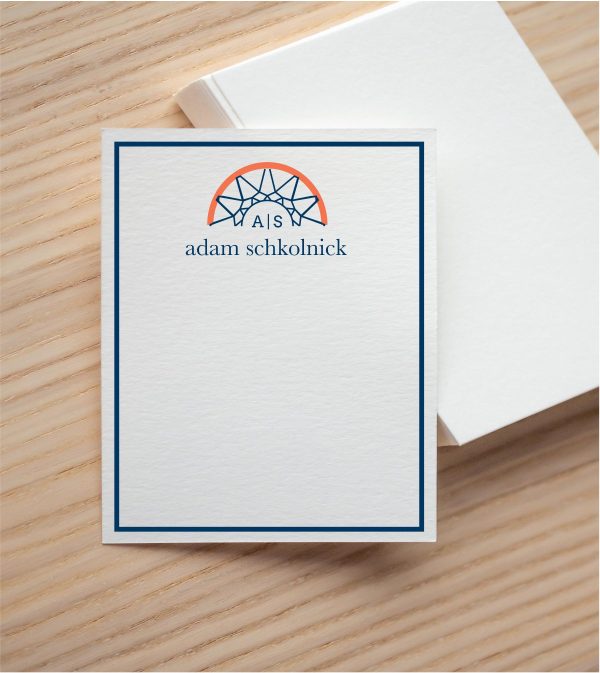 Personalized basketball note card with a navy geometric hoop and net, orange rim, monogram, and name in serif type on ecru stock.